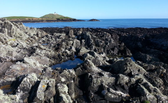 Ballycotton lower cliffs with lighthouse view Ireland