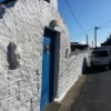 White wall with blue door Ballycotton, East Cork - Ireland